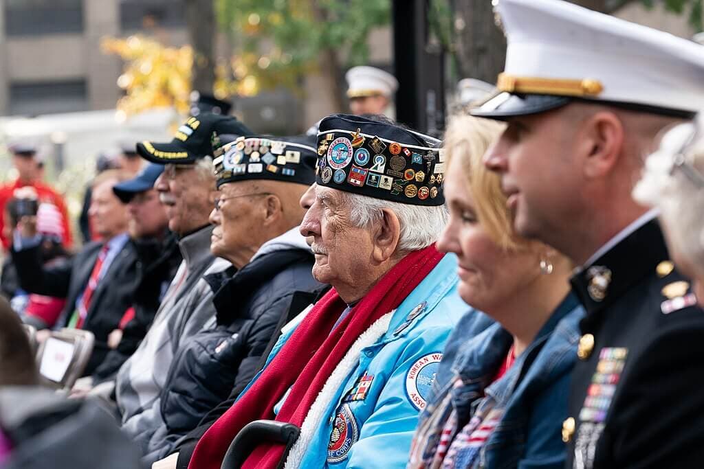 Veterans of all ages at a parade with Melinda Trump